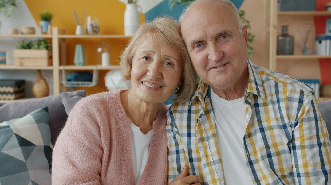 elderly couple smiling